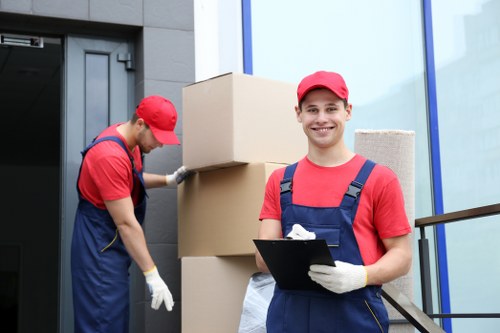 Professional movers handling furniture during a small relocation