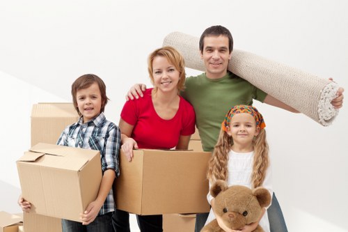 Boxes, furniture, and seasonal items arranged in household storage